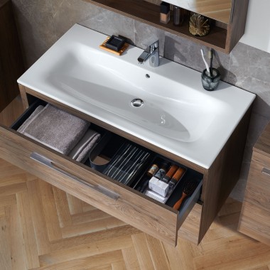 The design forms a perfect unit with the washbasin cabinets and matching furniture