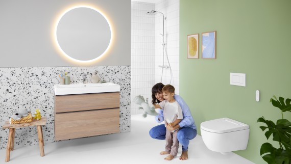 Geberit AquaClean Alba with woman and child in the bathroom